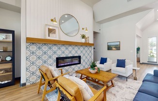 a living room with a fireplace and blue and white tiles