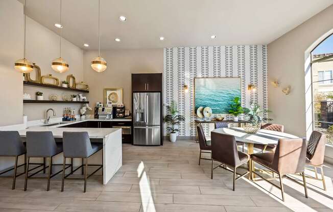 A modern kitchen with a dining table and chairs.