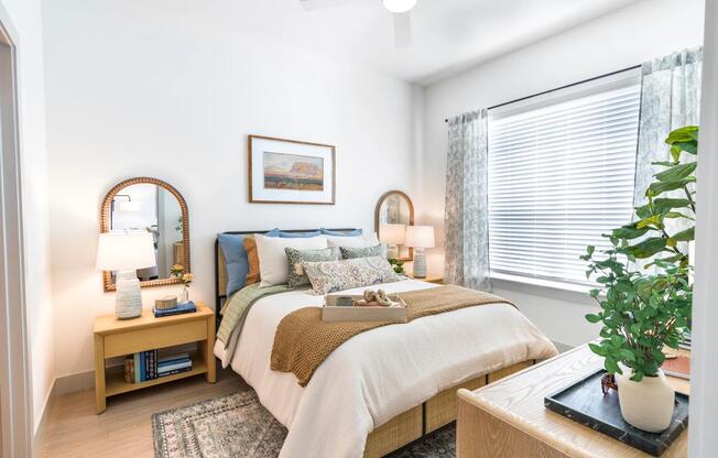 Experience a calming retreat in your bedroom with oversized windows, warm natural light, and space to unwind.
