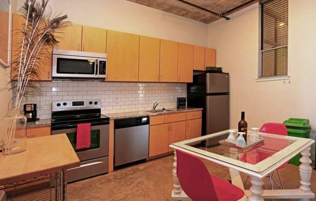 Well Equipped Kitchen And Dining at 1221 Broadway Lofts, San Antonio
