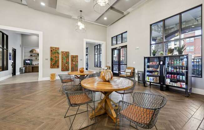 A dining room with a wooden table surrounded by chairs.