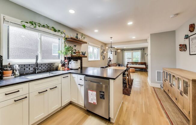 Welcome to this fully renovated, contemporary row home nestled in Michigan Park!