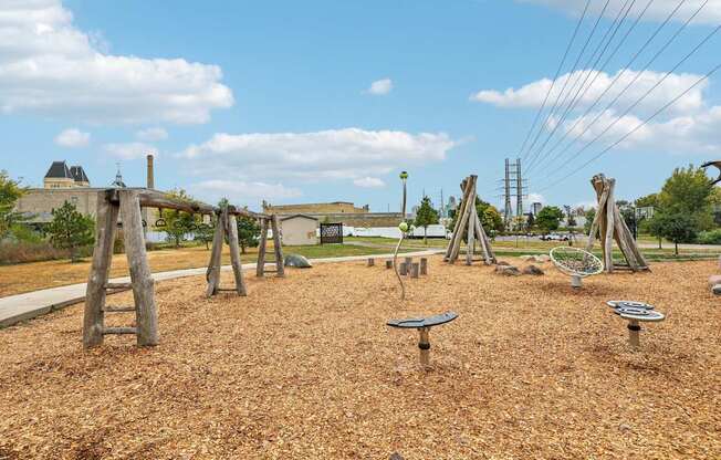 A playground with wooden swings and slides.