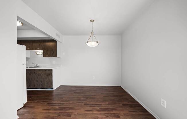 Spacious dining room area ta Knottingham Apartments in Clinton Township, MI.