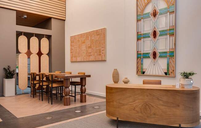 A reception area with a wooden table and chairs.