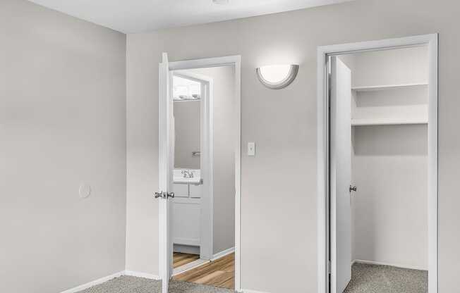 A white door is open to a hallway.