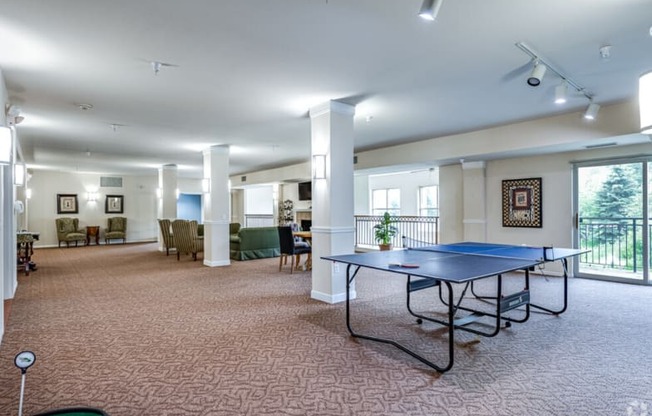 a game room with a ping pong table