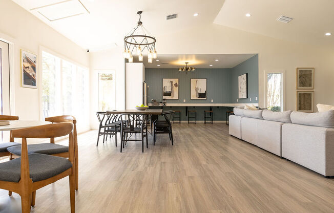 a living room and dining room with a hardwood floor and a vaulted ceiling at Sunset Canyon, San Antonio, TX, 78232