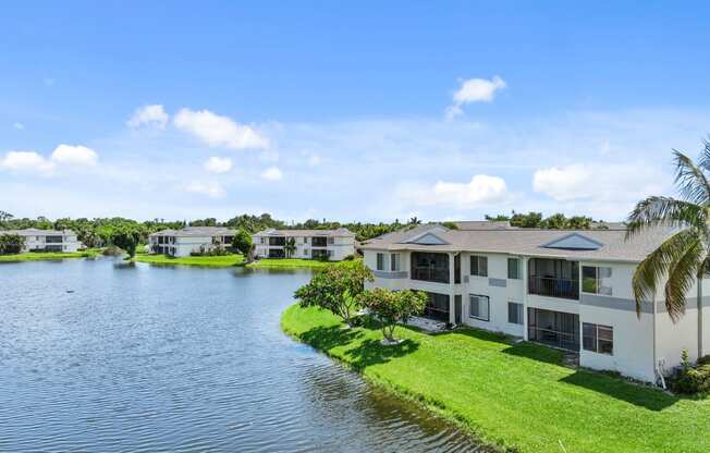 a group of houses next to a body of water