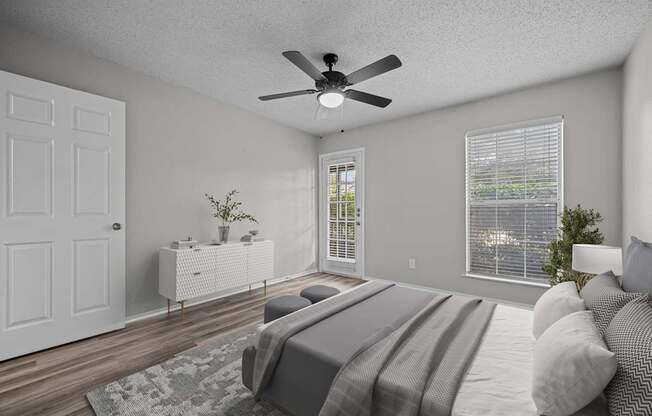 A bedroom with a bed, dresser, and window.