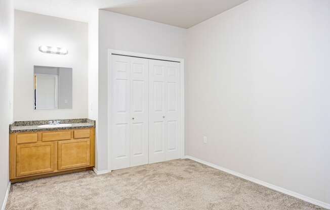 A white door is in a white wall.