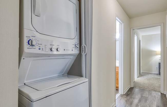 an empty laundry room with a washer and dryer