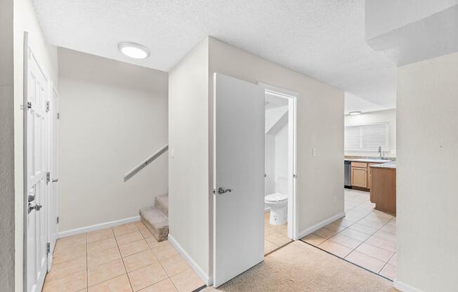 a kitchen with a sink and a refrigerator