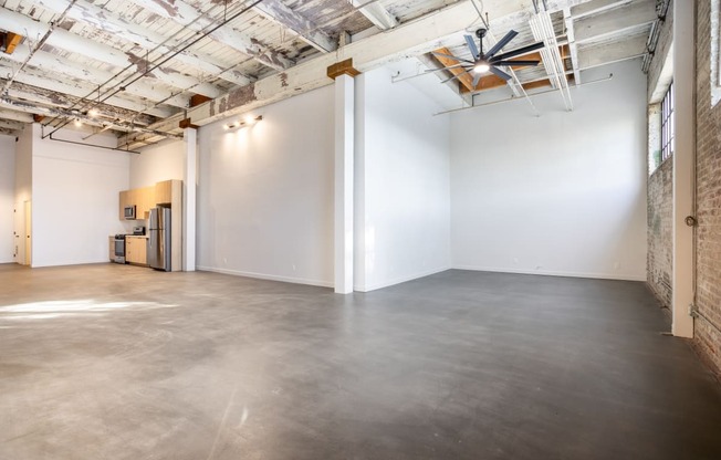 Santa Fe Art Colony  room with a concrete floor and white walls