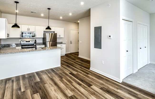 Studio, one and two bedroom apartment homes featuring stainless steel appliances, luxury vinyl floor, granite countertops, large closets and full-size washer and dryer at The Parker in Papillion, NE