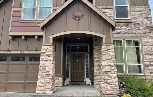 Stylish 5-Bedroom Home with Modern Kitchen, Stone Fireplace & Luxurious Primary Suite