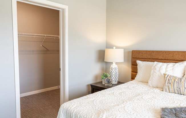a bedroom with a bed and a closet