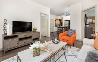 a living room with a couch and a tv