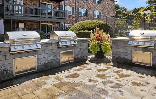 Outdoor BBQ Area and Landscape at Middlesex Crossing Apartments located in Billerica, MA.