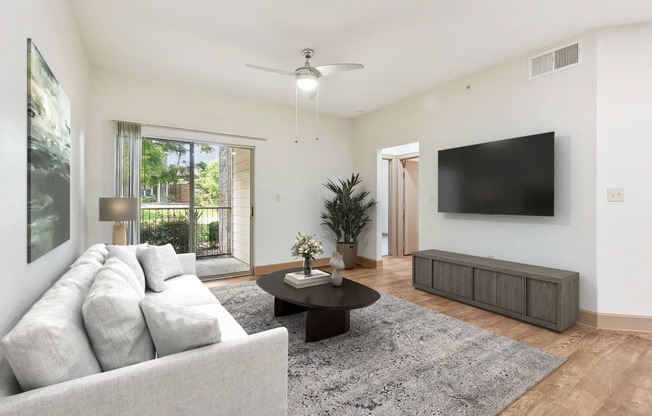 a living room with a couch and a tv