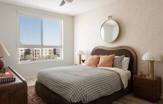 A serene bedroom retreat with warm textures, designer lighting, and natural light pouring in from expansive windows.