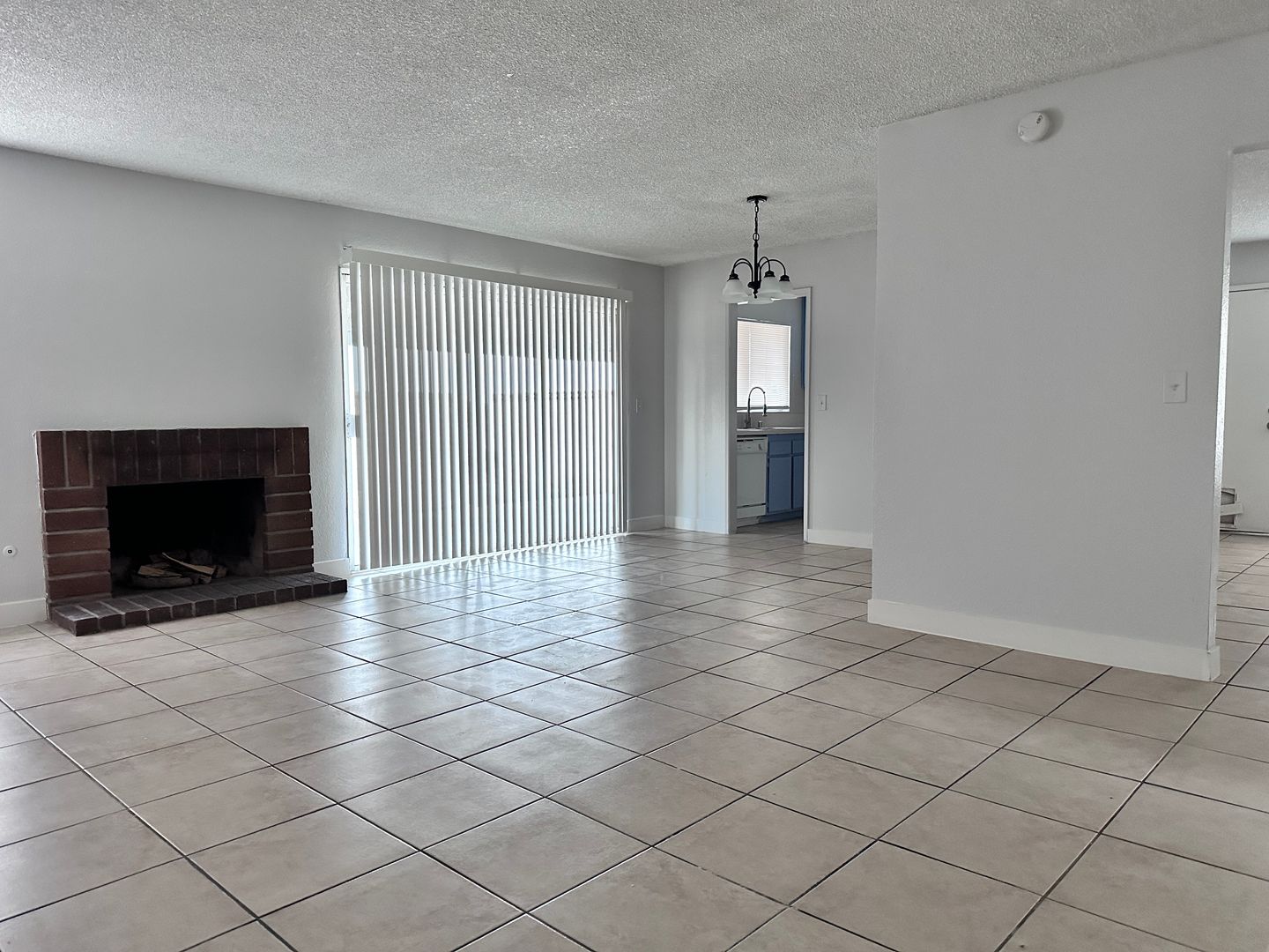 FRESH PAINT INSIDE, 4 BEDROOM HOME HAS A VERY SPACIOUS OPEN LAYOUT THAT FEATURES A FIREPLACE AND SEPARATE HIDDEN KITCHEN SPACE