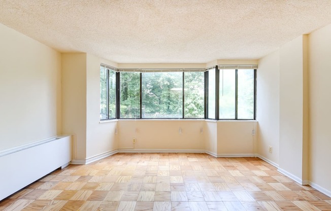 vacant living area with large windows at twin oaks apartments columbia heights washington dc