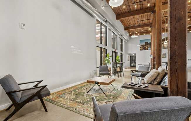 a living room filled with furniture and a large window