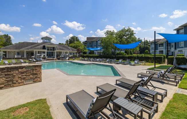 our apartments offer a swimming pool with chairs and umbrellas