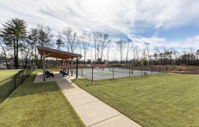 the pavilion overlooking the tennis courts at the whispering winds apartments in pearland