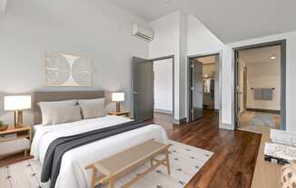 Bedroom with a large bed and a closet at Equinox, Seattle, WA, 98102