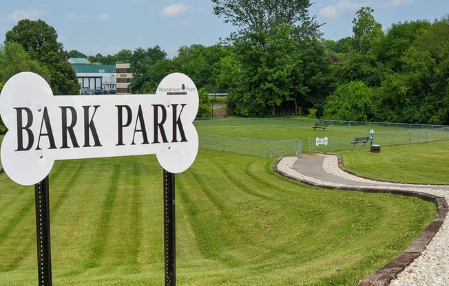 a park with a sign that reads bark park