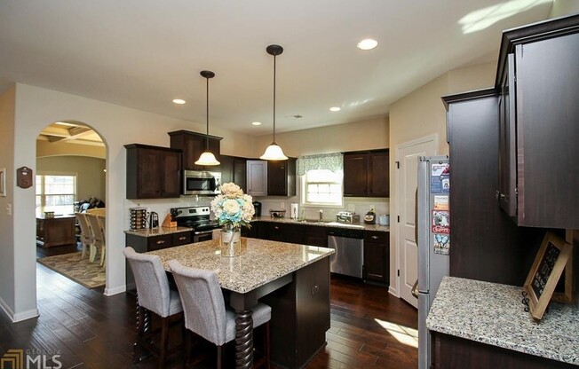 Wow, prime prime Newnan location, approx 1 mile to EVERYTHING! Hardwoods, Stainless, coffered ceilings, must see!
