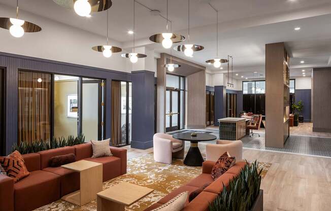 A modern living room with a red couch and a coffee table.