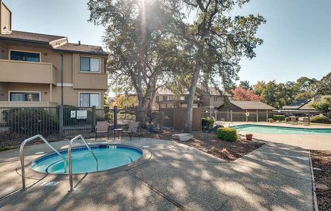 a hot tub and a pool in front of a building