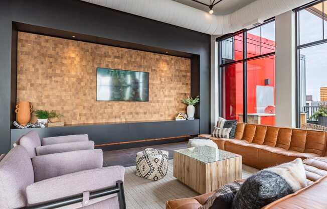 a living room with couches and chairs and a large window