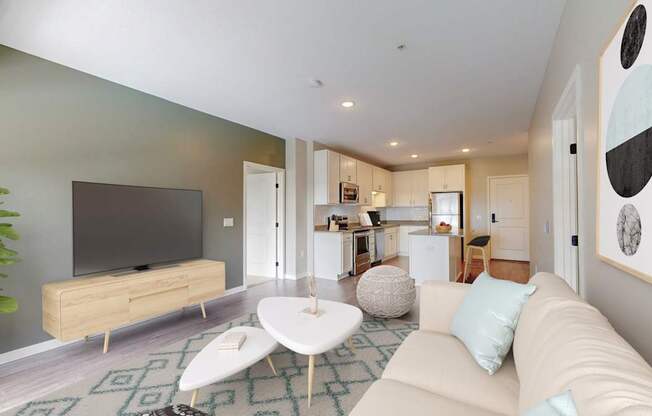 A living room with a white couch and a television.