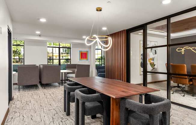 A conference room with a long table and chairs.