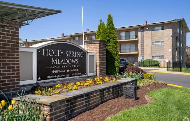 Holly Spring Meadows is apartment complex with a sign in front.