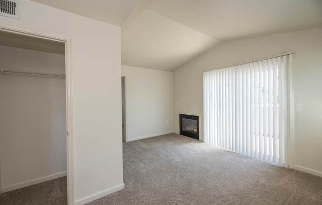 A room with a fireplace and a window with blinds at Autumn Oaks Apartments, Roseville, CA, 95678
