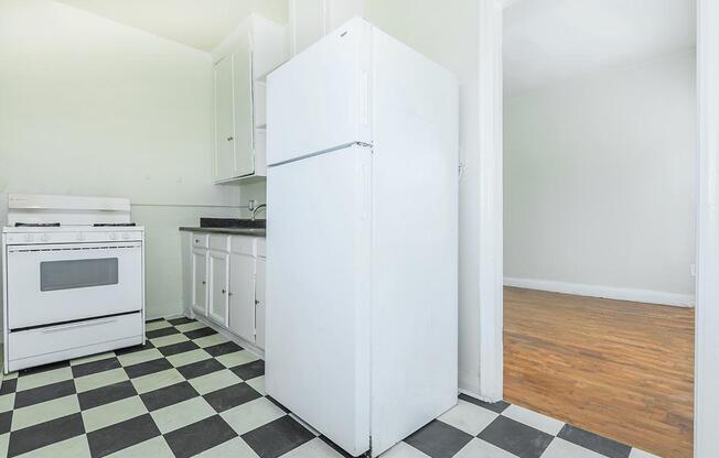 a kitchen with a tile floor