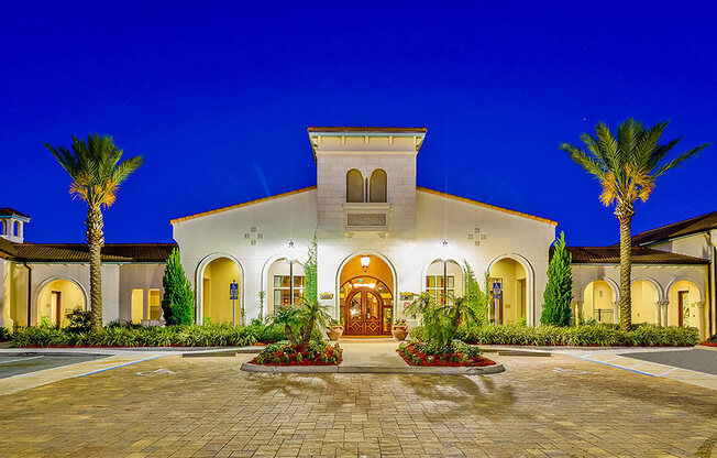a house with a driveway and palm trees in front of it  at Hacienda Club, Jacksonville, FL, 32256