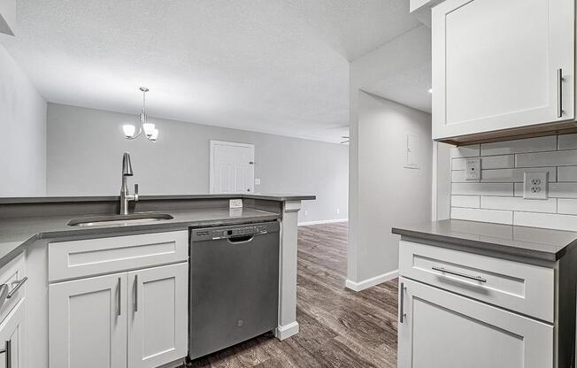 a kitchen with a sink and a refrigerator