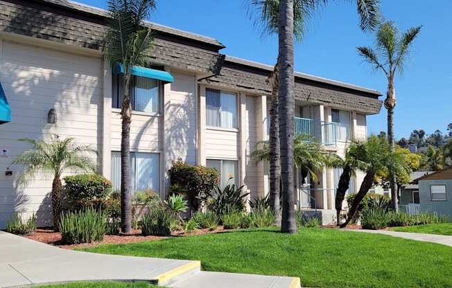 Sidewalk view of the front enterance to La Mesa Village apartments.