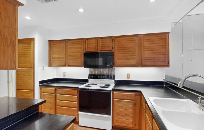 Spacious Townhome with Lake Views on a Prime Corner Lot Near Sapphire Bay