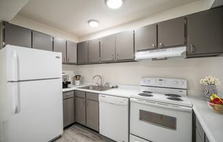 a kitchen with white appliances and gray cabinets at Summit, Pocatello, 83201