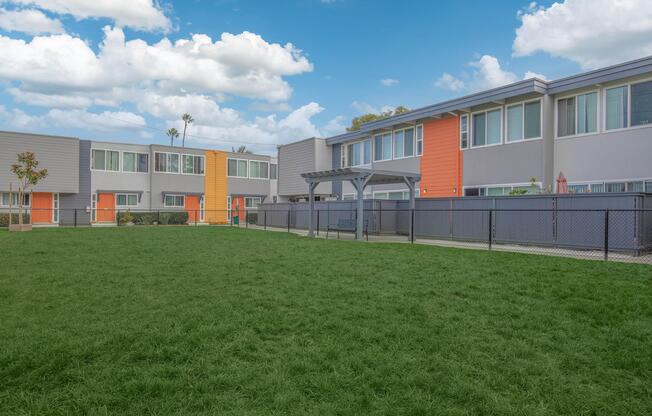 a large building with a grassy field