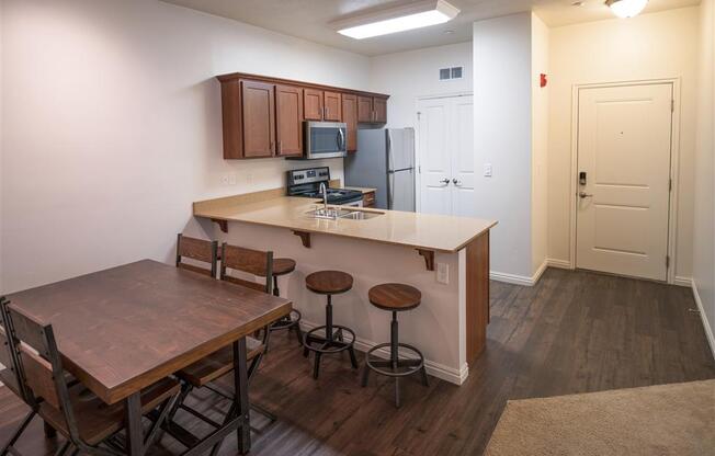 Dining Room and Kitchen View at Four Seasons Apartments & Townhomes, Utah, 84341