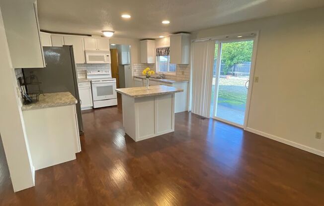 Newly remodeled rare four bedroom home with giant fenced yard!