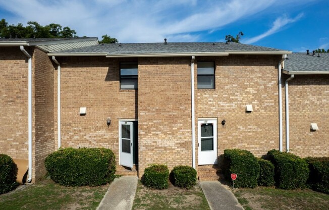 Welcome to Courtyards Apartments, where comfort meets convenience. Our charming brick exteriors and inviting doors create a warm community atmosphere. Explore spacious living options and modern amenities. Schedule your visit today for a personal tour!